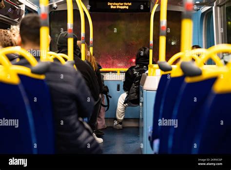 Double decker bus interior with passengers Stock Photo - Alamy