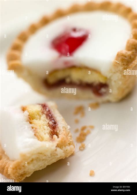 Bite of a Cherry Bakewell Tart Stock Photo - Alamy