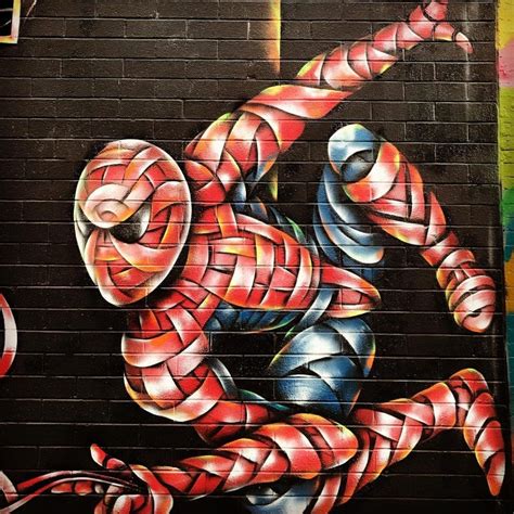 Otto Schade paints spider-man mural in New York as Stan Lee tribute