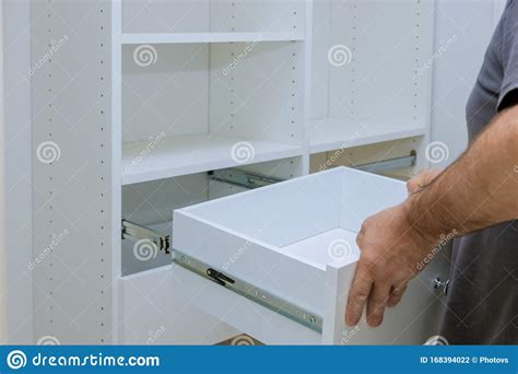 Worker Sets the Box Installation the Drawer for Closet Cabinet Stock ...