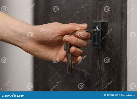 Woman Unlocking Door with Key, Closeup View Stock Image - Image of ...