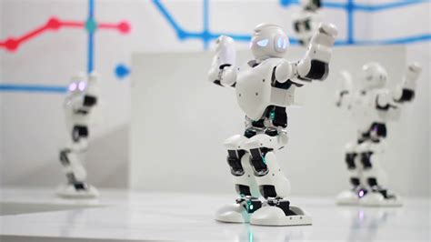 Humanoid robot dance. Group of cute robots dancing. Close up of smart ...