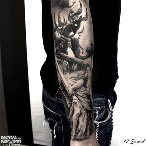 black and grey realistic angel and demon tattoo