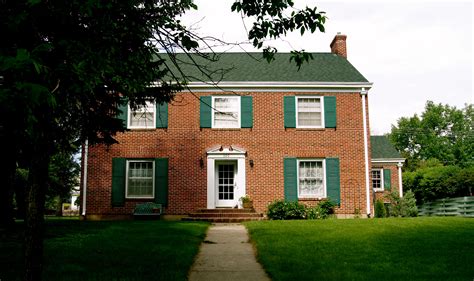 Red Brick House With Shutters