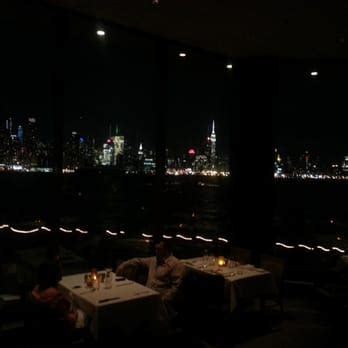 Chart House - Night time shot of Manhattan overlooking the Hudson beautiful view fishbowl affect ...