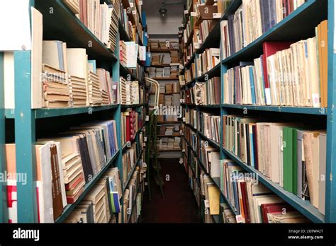 Many books on bookshelf in library Stock Photo - Alamy