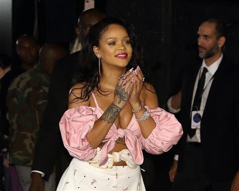 Rihanna Reveals Chest Tattoo While Promoting Fenty Beauty