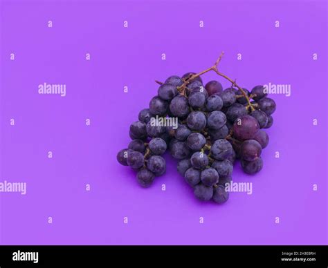 Red and white grapes, purple background. Top view, photo, vintage wine ...