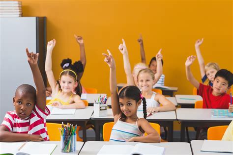 School kids raising hand in classroom - Healthy Schools PA