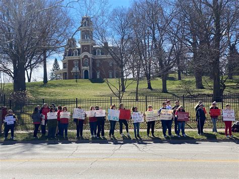 Over 100 Iowans gather to protest Gov. Kim Reynolds' policies