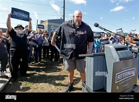 John Fetterman, center, the mayor of Braddock, Pa., comes forward to announce his candidacy for ...