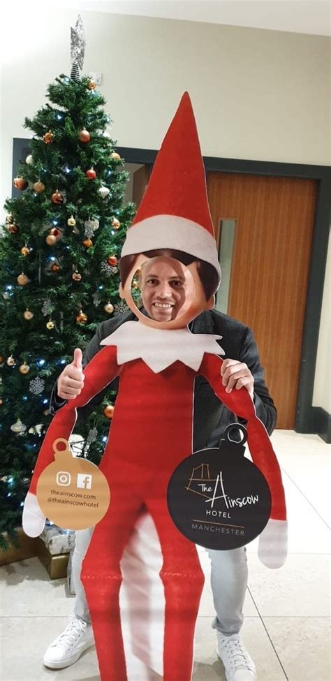 A real life elf is roaming Manchester giving out Christmas treats