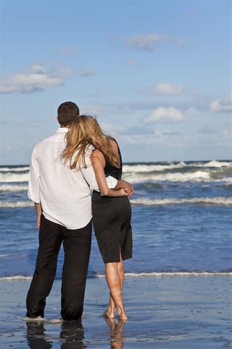 Man and Woman Couple in Romantic Embrace on Beach Stock Image - Image of ocean, girl: 12398807