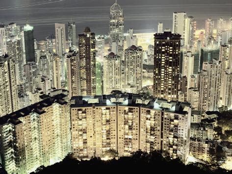 Hong Kong skyscrapers and apartment blocks at night Photographic Print by Martin Puddy at ...