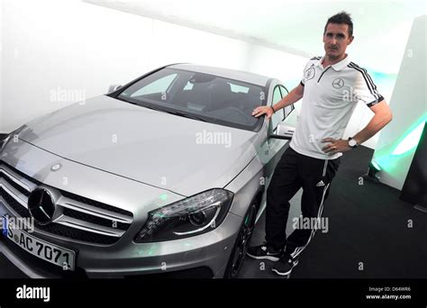 Germany's Miroslav Klose poses next to a Mercedes car after a press ...