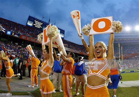 Cheerleaders of the Tennessee Volunteers try to get the fans into the ...