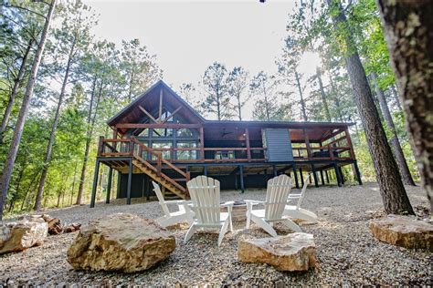 Broken Bow Cabins Texas Time exterior and firepit with Adirondack ...