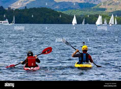Two people kayaking on Lake Windermere in the Lake District National ...