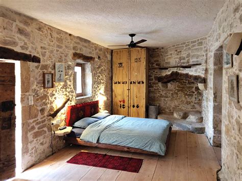 renovated old stone house in greece reuses original materiality