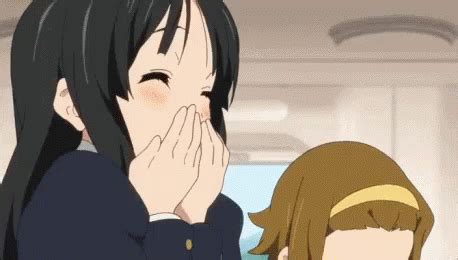 an anime girl covers her face with her hands