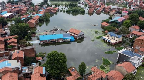 China: At least 14 dead as Yangtze river rises 50ft above flood level ...