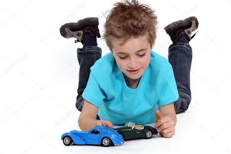 Little boy playing with toy cars — Stock Photo © photography33 #9767029