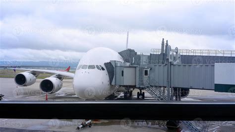 Modern jet bridge connection and airplane. 12831083 Stock Photo at Vecteezy