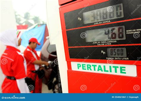 Operator Pertamina Gas Station Serving Buyers by Filling Pertalite ...