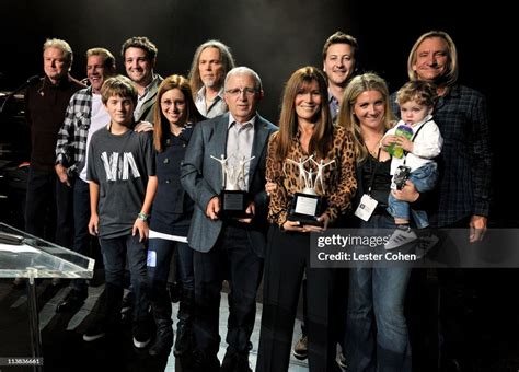 Shelli Azoff and Irving Azoff and the Azoff family pose for a... News ...