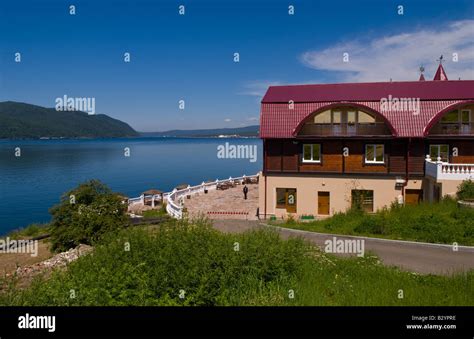 Beautiful relaxed on shore at the Baikal Legend Hotel with boats at Listvyanka in Lake Baikal ...