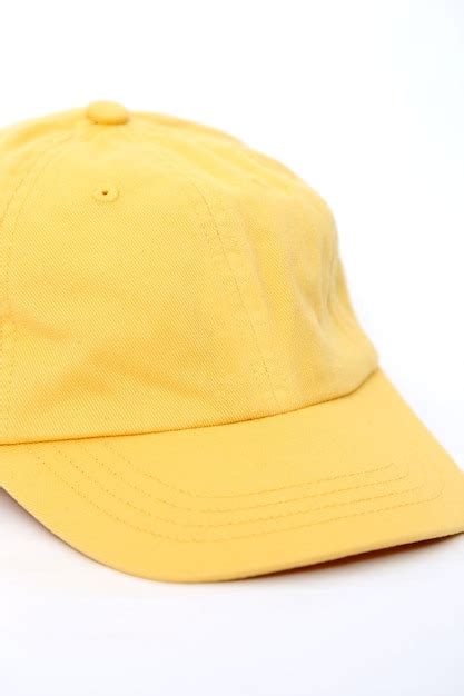 Premium Photo | Yellow baseball cap