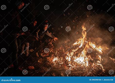 BELGRADE, SERBIA - JANUARY 6, 2023: Selective Blur on Serbian People Burning Badnjak Branches in ...