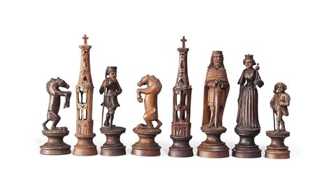 A GERMAN SOFTWOOD FIGURAL CHESS SET , EARLY 20TH CENTURY | Christie's