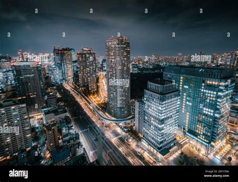 Aerial View of Skyscraper Rooftops and Futuristic Skyline at Night with ...