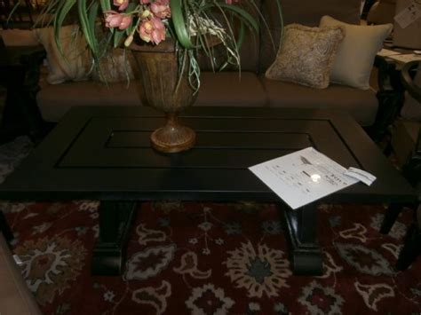 Jet black metal outdoor coffee table. Measures 48x23x21. Matching end tables, chairs and ottoman ...