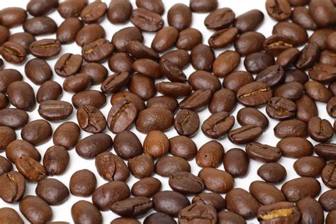 Roasted coffee beans background 8617377 Stock Photo at Vecteezy