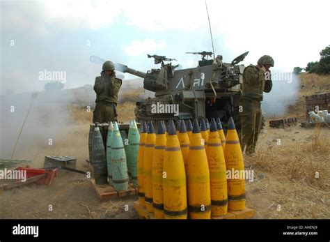 Israeli M109 self-propelled howitzer firing 155mm shells into Hezbollah positions in Lebanon ...