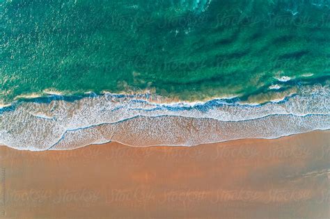 "Aerial View Of A Wild Beach At Sunset" by Stocksy Contributor "Marco Govel" - Stocksy