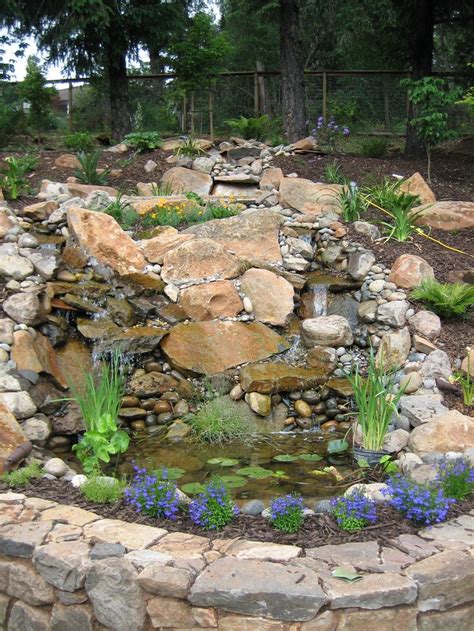 Backyard waterfall made from river rock and slate - very natural. | Water Therapy | Pinterest