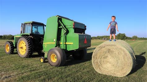 Working on the farm with tractors | Baling hay for kids | Round baler ...