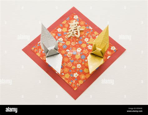 Folded paper crane Stock Photo - Alamy