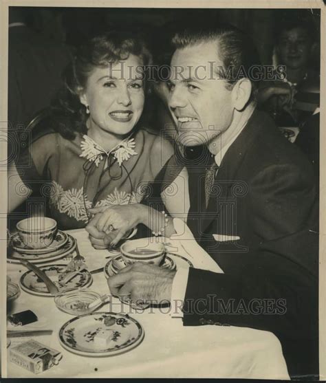 Rhonda Fleming, Actress at table with husband - Historic Images