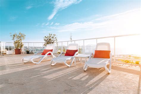 Photo of Three White Deck Chairs Sun loungers · Free Stock Photo