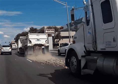 VIDEO: Truck Dumps Load Of Rocks On Road