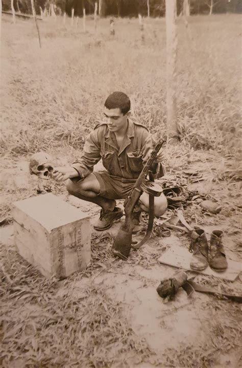 My grandfather during the Portuguese Colonial War in Angola, 1968 holding a PPSh-41 in one hand ...