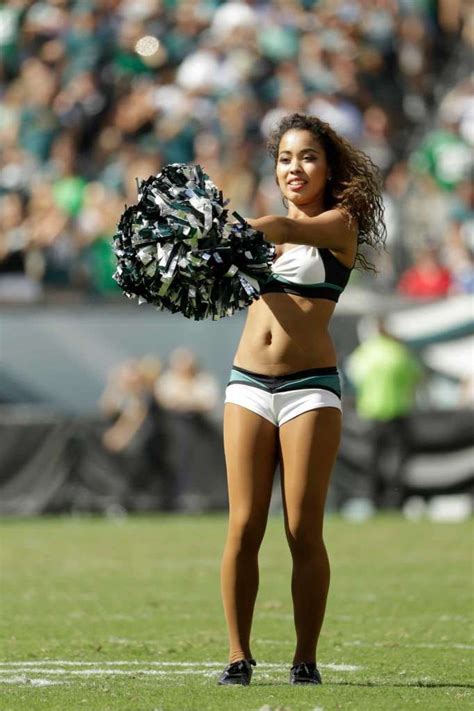 A Philadelphia Eagles' cheerleader performs during the second half of ...