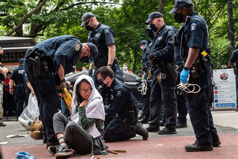 Climate activists cuffed at Downtown protest over Public Renewables Act ...