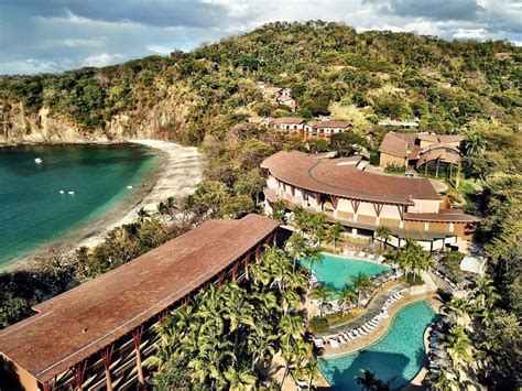 Aerial view of Four Seasons Hotel Costa Rica at Peninsula Papagayo building, resort by sand ...