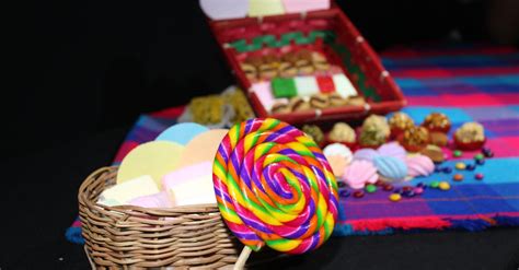 Close Up Photo of Lolipop Beside Woven Basket · Free Stock Photo