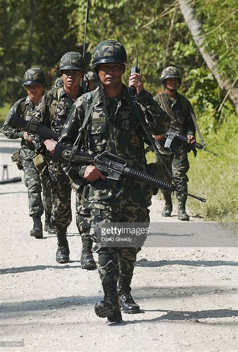 Philippine Marines Patrol In Southern Mindanao Photos and Premium High ...